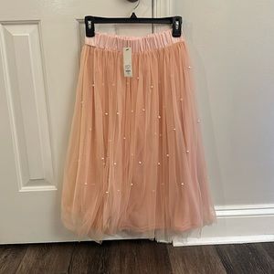 Light pink skirt with pearl flounce twirl and have fun